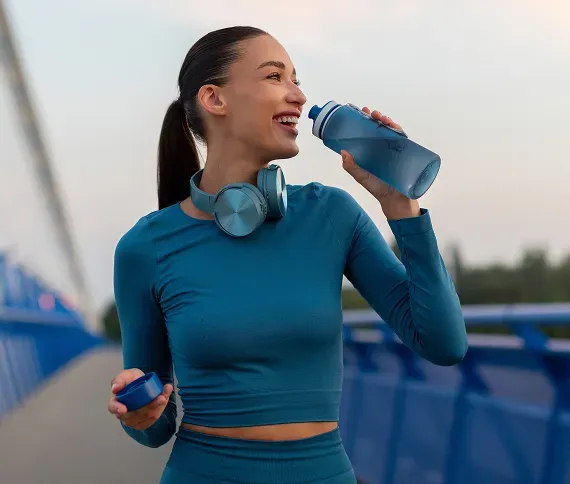 Woman staying hydrated after exercise during medical weight loss treatment